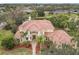 Luxury home with tile roof, landscaping, and a large backyard at 2683 Wyndsor Oaks Way, Winter Haven, FL 33884
