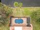Aerial view showcasing the home's private setting and screened-in pool at 2683 Wyndsor Oaks Way, Winter Haven, FL 33884