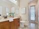 Bathroom with granite vanity, walk-in shower, and private access at 2683 Wyndsor Oaks Way, Winter Haven, FL 33884