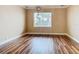 Simple bedroom with hardwood floors and a window at 2683 Wyndsor Oaks Way, Winter Haven, FL 33884