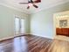 Bright bedroom with wood flooring, french doors, and ceiling fan at 2683 Wyndsor Oaks Way, Winter Haven, FL 33884