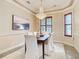 Elegant dining room featuring a chandelier and large window at 2683 Wyndsor Oaks Way, Winter Haven, FL 33884