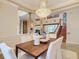 Formal dining room with a chandelier and hardwood floors at 2683 Wyndsor Oaks Way, Winter Haven, FL 33884