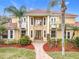 Two story home with tile roof and manicured landscaping at 2683 Wyndsor Oaks Way, Winter Haven, FL 33884