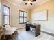 Bright home office features built-in shelving and hardwood floors at 2683 Wyndsor Oaks Way, Winter Haven, FL 33884