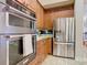 Modern kitchen features stainless steel appliances and ample cabinetry at 2683 Wyndsor Oaks Way, Winter Haven, FL 33884