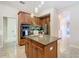 Island kitchen with stainless steel appliances and granite counters at 2683 Wyndsor Oaks Way, Winter Haven, FL 33884