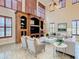 Living room with built-in entertainment center and comfortable seating at 2683 Wyndsor Oaks Way, Winter Haven, FL 33884