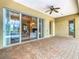 Covered patio with sliding glass doors offering seamless indoor-outdoor living at 2683 Wyndsor Oaks Way, Winter Haven, FL 33884