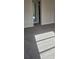 Neutral carpeted bedroom featuring a standard closet and natural lighting streaming into the space at 333 Lake Howard Nw Dr # 202-A, Winter Haven, FL 33880