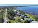 Aerial view of lakefront homes with lush landscaping and private docks at 3340 Crump Rd, Winter Haven, FL 33881