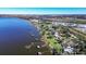Aerial view showcasing a lakefront property with dock access at 3340 Crump Rd, Winter Haven, FL 33881