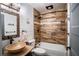 Bathroom with updated fixtures and a tub shower combo at 3340 Crump Rd, Winter Haven, FL 33881