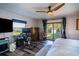 Main bedroom with water views, a workspace, and sliding glass doors at 3340 Crump Rd, Winter Haven, FL 33881
