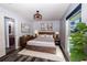 Spacious bedroom featuring a wooden bed frame and en-suite bathroom at 3340 Crump Rd, Winter Haven, FL 33881