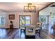 Bright dining room with glass table and lake view at 3340 Crump Rd, Winter Haven, FL 33881