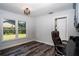 Bright home office features large windows, wood-look floors, and a built-in desk at 3340 Crump Rd, Winter Haven, FL 33881