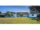 Back of house, showcasing the large windows and backyard at 3340 Crump Rd, Winter Haven, FL 33881
