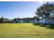 Back of house with large yard and detached shed at 3340 Crump Rd, Winter Haven, FL 33881