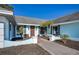 Light blue house exterior with walkway and landscaping at 3340 Crump Rd, Winter Haven, FL 33881