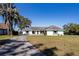House front view, showcasing the driveway and landscaping at 3340 Crump Rd, Winter Haven, FL 33881