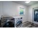 Laundry room with LG washer and dryer and exterior access at 3340 Crump Rd, Winter Haven, FL 33881