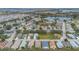 Aerial view of Carlsberg Estates neighborhood, showcasing homes and lake at 340 Lake Suzanne Dr, Lake Wales, FL 33859