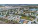 Aerial view of Carlsberg Estates, featuring numerous houses and a lake at 340 Lake Suzanne Dr, Lake Wales, FL 33859