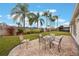 Landscaped backyard with patio and seating area at 340 Lake Suzanne Dr, Lake Wales, FL 33859