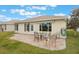 Home exterior with patio and seating area, great for outdoor dining at 340 Lake Suzanne Dr, Lake Wales, FL 33859