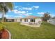 Spacious backyard with patio and lush lawn at 340 Lake Suzanne Dr, Lake Wales, FL 33859