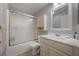 Updated bathroom with tub, toilet, and vanity at 340 Lake Suzanne Dr, Lake Wales, FL 33859