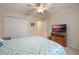 Bedroom with ceiling fan, TV and walk-in closet at 340 Lake Suzanne Dr, Lake Wales, FL 33859