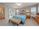 Spacious bedroom with ceiling fan and access to a private patio at 340 Lake Suzanne Dr, Lake Wales, FL 33859
