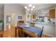 Dining area with wood table and chairs, and a view of kitchen at 340 Lake Suzanne Dr, Lake Wales, FL 33859