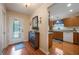 Bright entryway with hardwood floors and view into kitchen at 340 Lake Suzanne Dr, Lake Wales, FL 33859