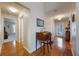 Entryway with hardwood floors, a writing desk, and view of another room at 340 Lake Suzanne Dr, Lake Wales, FL 33859
