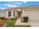 Well-maintained house with a two-car garage and landscaped front yard at 340 Lake Suzanne Dr, Lake Wales, FL 33859
