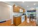 Kitchen with wood cabinets, gas range, and breakfast nook at 340 Lake Suzanne Dr, Lake Wales, FL 33859