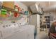 Laundry room with washer, dryer and extra storage at 340 Lake Suzanne Dr, Lake Wales, FL 33859