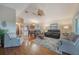 Relaxing living room with hardwood floors, comfortable seating, and a ceiling fan at 340 Lake Suzanne Dr, Lake Wales, FL 33859