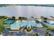 Resort-style community with pool, tennis courts, and clubhouse near lake at 3457 Raleigh Dr, Winter Haven, FL 33884