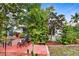 Relaxing patio with lush landscaping and seating area at 3457 Raleigh Dr, Winter Haven, FL 33884