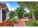 Landscaped brick pathway leading to a relaxing patio area at 3457 Raleigh Dr, Winter Haven, FL 33884