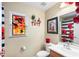 A cheerful bathroom with unique stained glass window and poppy shower curtain at 3457 Raleigh Dr, Winter Haven, FL 33884
