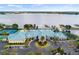Lakeside clubhouse with tennis courts and parking at 3457 Raleigh Dr, Winter Haven, FL 33884