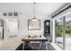Dining area with modern table and chairs, and view into living room at 3457 Raleigh Dr, Winter Haven, FL 33884