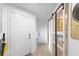 Bright entryway with white doors and glass barn door at 3457 Raleigh Dr, Winter Haven, FL 33884