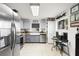 Modern kitchen with stainless steel appliances and a farmhouse sink at 3457 Raleigh Dr, Winter Haven, FL 33884