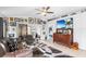 Living room with unique decor, comfortable seating, and access to a patio at 3457 Raleigh Dr, Winter Haven, FL 33884